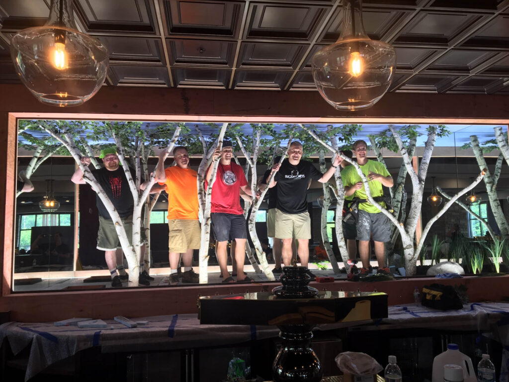 Adam and the construction and design team in the 'Infinity Forest' at Buck & Honeys.