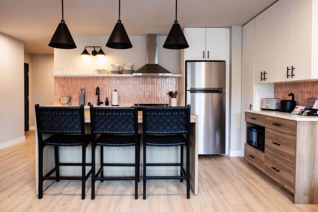 Interior kitchen view at The Dylin Aparthotel in Madison, WI | Designed by JLA Architects